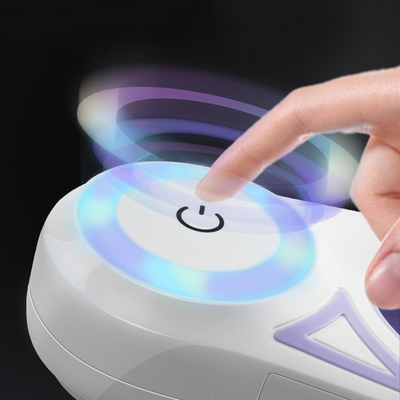 Person pressing power button on the best LED leash for walking dogs at night with glowing blue light