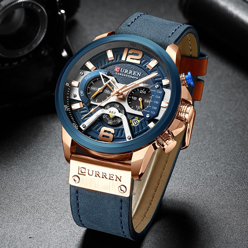 Military chronograph leather watch with blue dial and rose gold case featuring multiple subdials