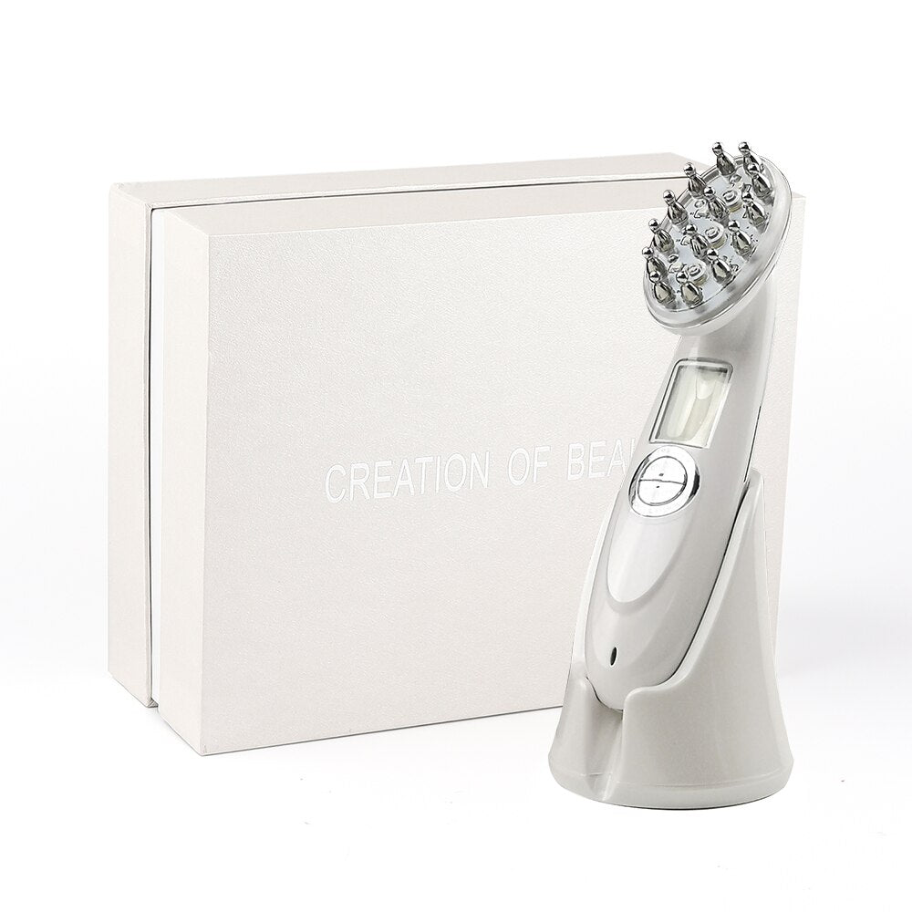 White laser hair regrowth device with metal massage nodes and digital display standing next to a beige box