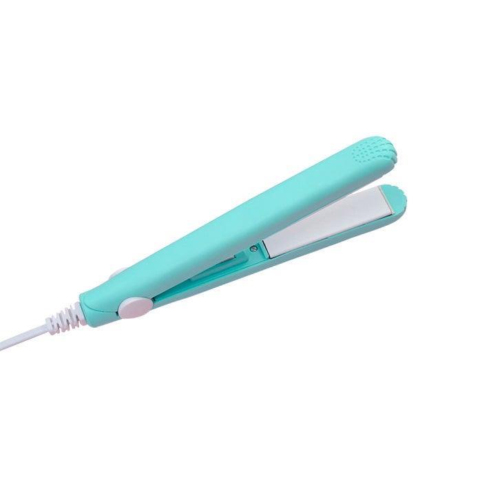 Turquoise mini ceramic hair straightener with white plates and power cord for travel and styling