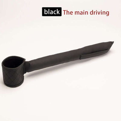 Black leather car seat gap filler designed to prevent items from falling between car seats