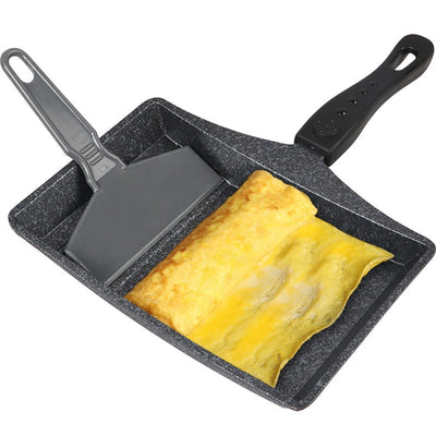 Non-Stick Wave Bottom Tamagoyaki Omelette Saucepan with cooked omelette and black spatula