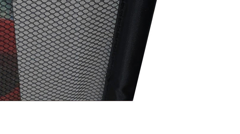Close-up view of a black mesh portable pet safety gate designed for easy pet containment