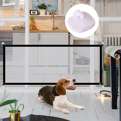 Portable pet safety gate black mesh barrier installed in doorway with beagle dog lying on floor