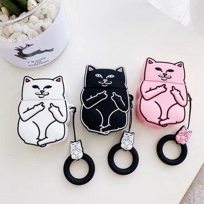 Three cartoon cat AirPods case covers in white black and pink with matching keychains on white table